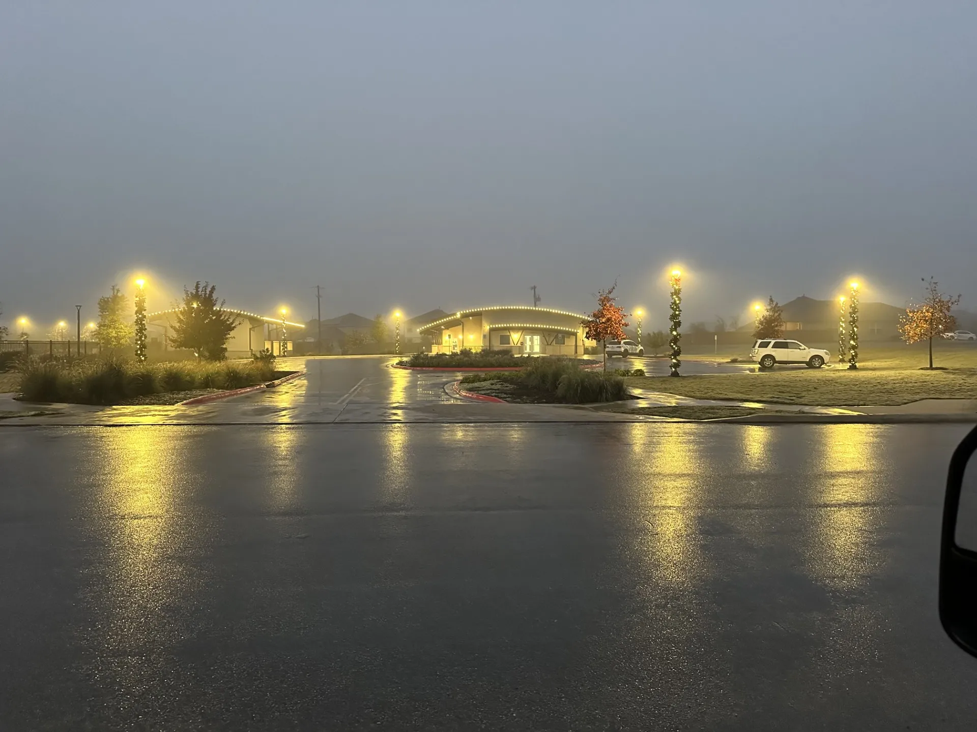 Community center with greenery and holiday lights