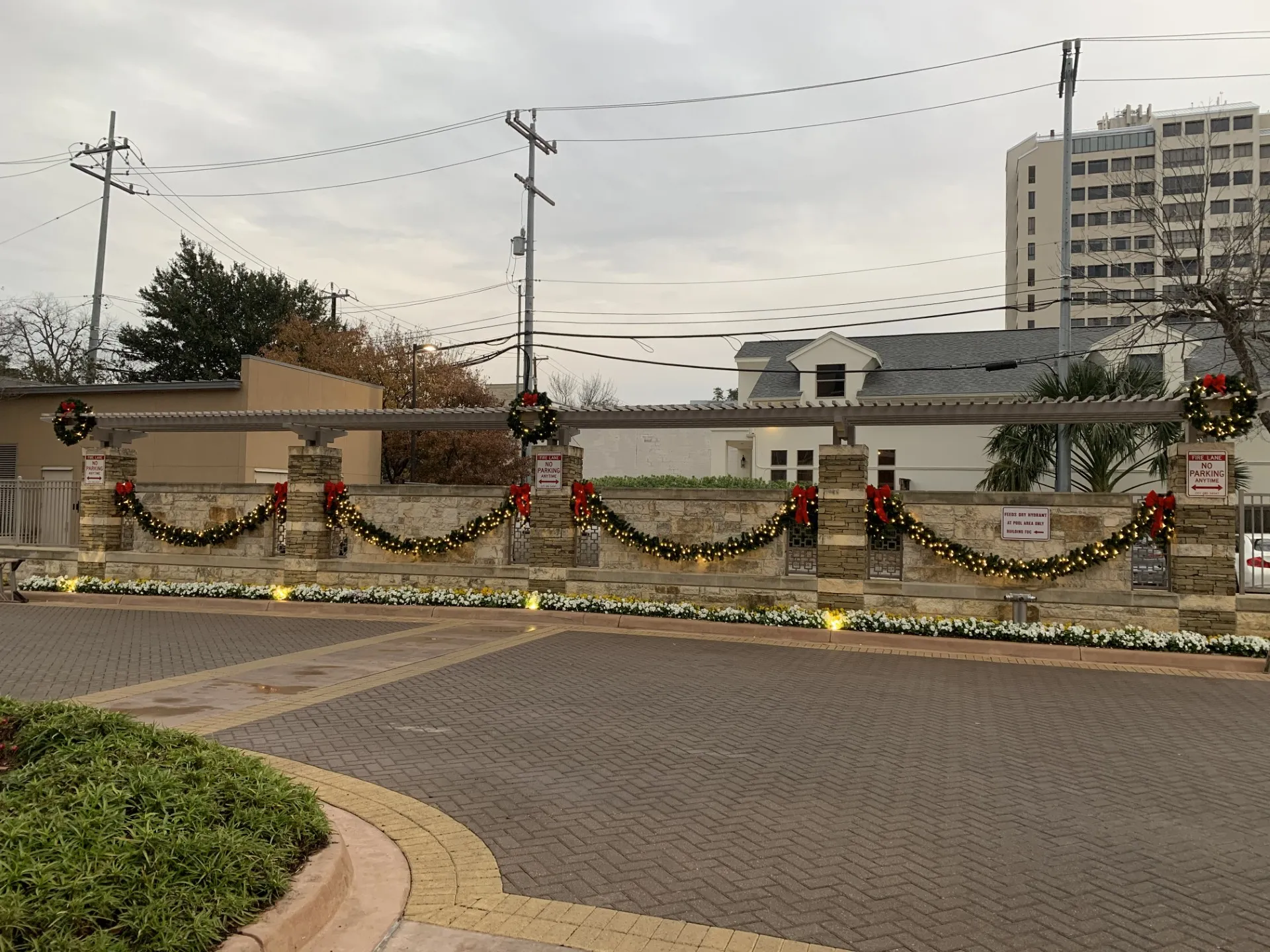 Lit garland and wreaths decorating a building