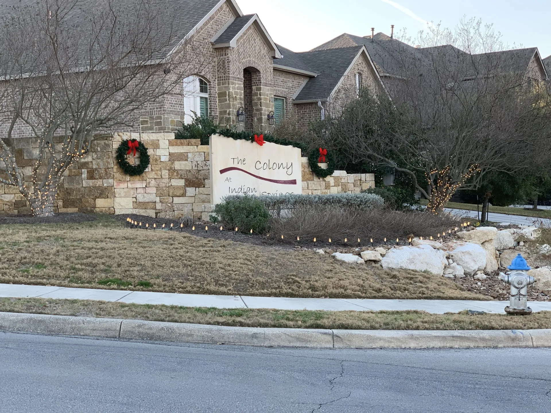 Residential entrance decorated with holiday lighting